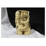 A Carved Bone Oriental Warrior