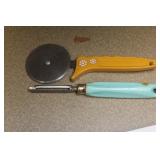 two retro era plastic handle untensils