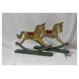 A Pair of Vintage Cast Iron Rocking Horses