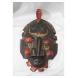 A Wooden Mask Form Wall Hanger
