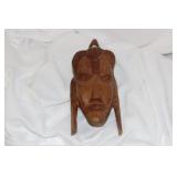 A Wooden Face Wall Hanger