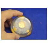 A Lucite and Penny Paperweight