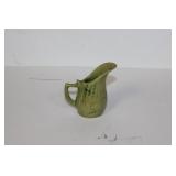 A Miniature Pottery Pitcher