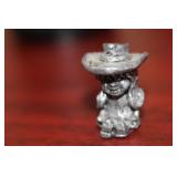A Small Pewter Cow Girl