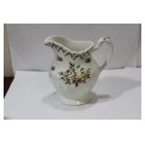 A Ceramic Pitcher/Creamer