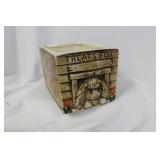 A Ceramic Dog Planter