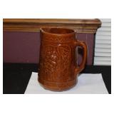 An Antique Majolica Brown Pitcher Pitting