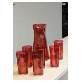 A Cranberry Cut Glass Tumbler and Pitcher