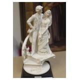 Armani figurine on stand