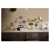 Lot of pendents, pins, etc.