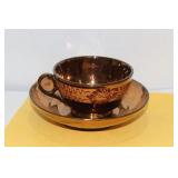 A Lusterware Cup and Saucer