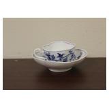 A Meissen Blue Onion Demitasse Cup and Saucer