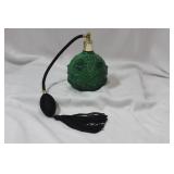 A Green Glass Parfume Bottle