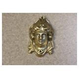 A Metal Head of a Lady