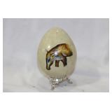 A Painted Stone Egg on Stand