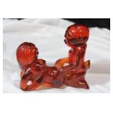 An Amber Resin Erotica Figurine