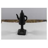 A Solid Metal Teapot on Stand