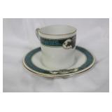 A Dematesse Cup and Saucer