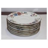 Set of 7 Limoge Saucers