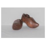 A Pair of Wooden Clog Form Candlesticks