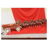 A Cast Iron Horse and Buggy with Wheelbarrows