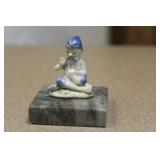 small ceramic oriental man on stand