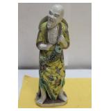 A Chinese Famille Juane Fisherman Figure