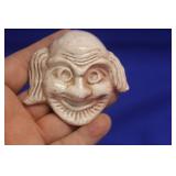 A Small Ceramic Face