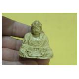 A Japanese Carved Resin God Figurine