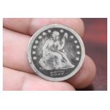 An 1877 Seated CC Quarter