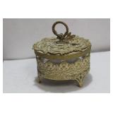 A Gilted Metal Glass Container