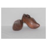 A Pair of Wooden Clog Form Candlesticks