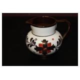 An Old Castle Copper Ceramic Luster Creamer