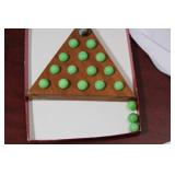 A Triangular Peg Solitaire Game