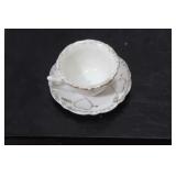 A Miniature Ceramic Cup and Saucer