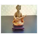 A Japanese Mid Century Resin Musician Figurine