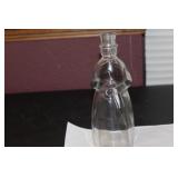 A Figureal Decanter Bottle