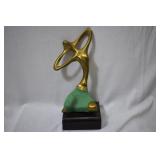 A Modern Brass Statue on Wood Block