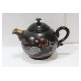 A Japanese or Chinese Lacquer Teapot