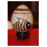 Carved Stone Egg on Woodstand