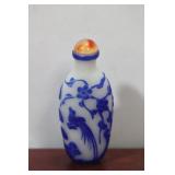 A Chinese Carved Overlay Peking Glass Snuff Bottle