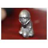 A Small Pewter Football Player