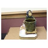 A Signed Pottery Figurine