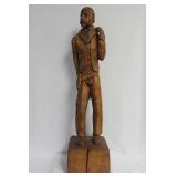 A Wood Statue of a Cowboy