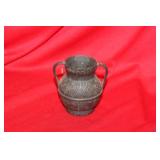 A Small Bronze Urn