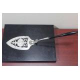 A Sterling and Wood Cake Server