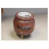 A pot of money wooden bank