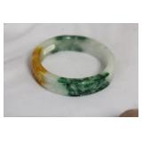 A Carved Jadeite Bangle Bracelet