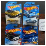 Four Hot Wheels Cars in Original Packaging