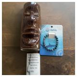 Tiki Face Mug and Shark Tracking Bracelet